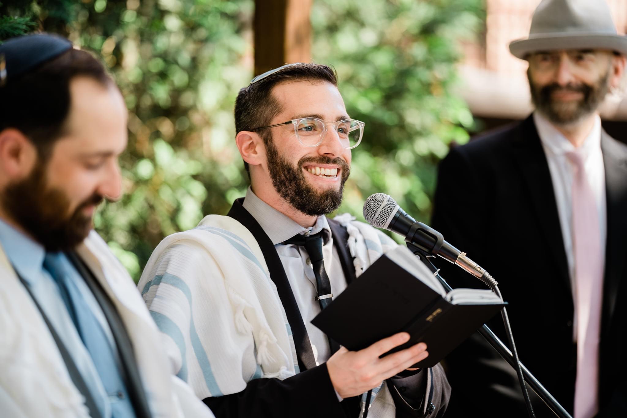 Rabbi Sam officiates at a wedding under the chuppah
